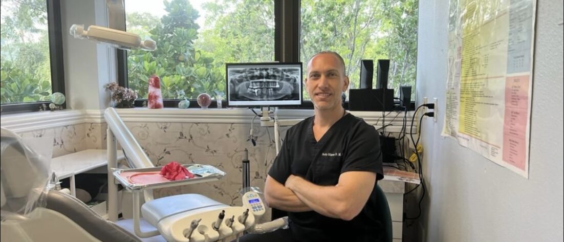 Dr. Seth Gilson, DMD - Mindful Doctor at the office with xrays