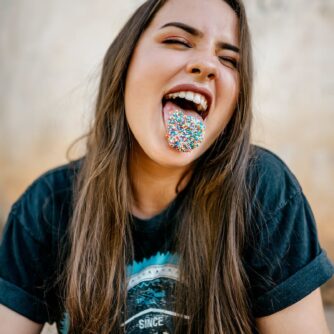 woman with candies on tongue
