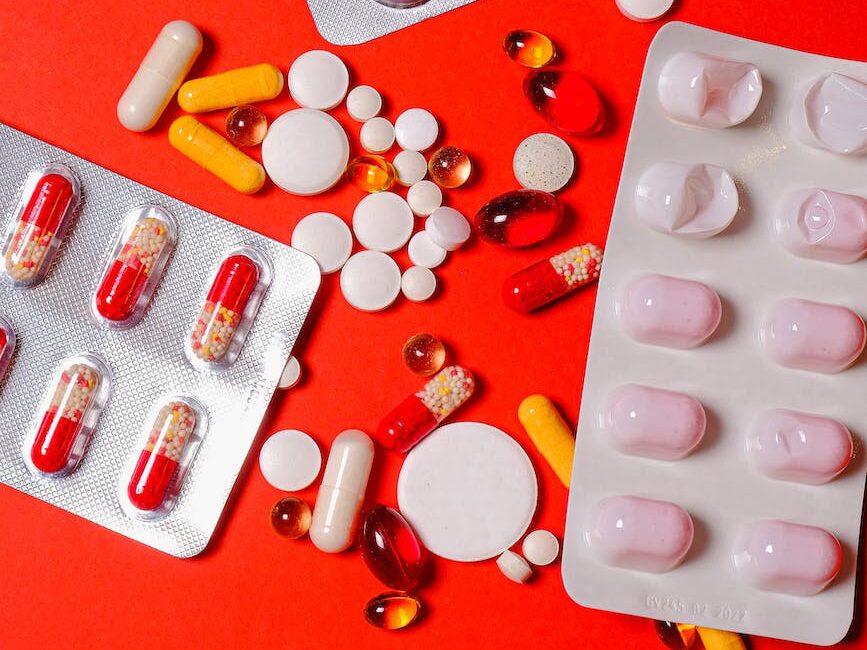 yellow and white red pills on blister pack