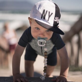 a boy wearing a cap