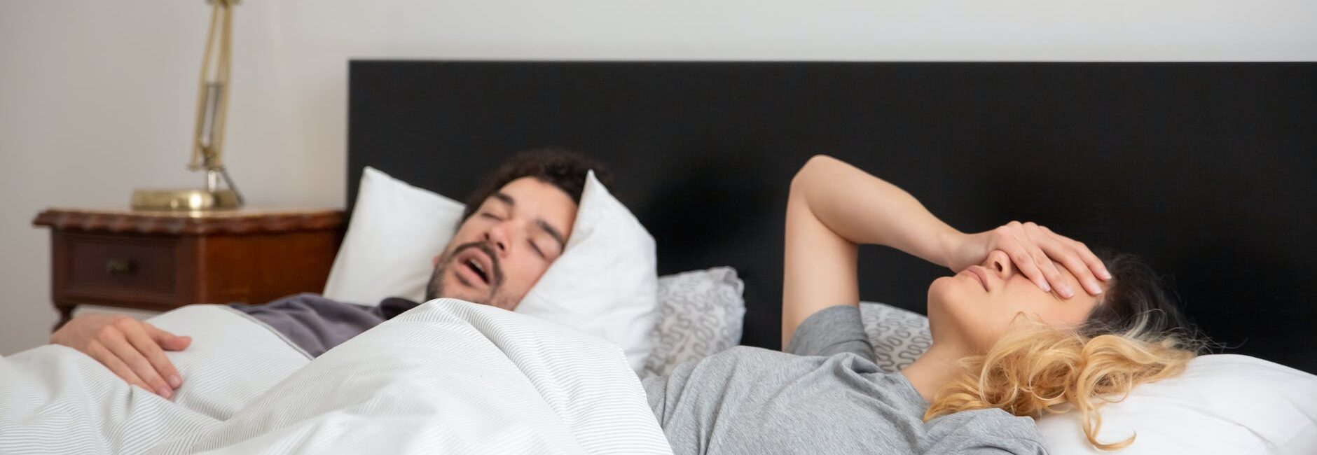 man sleeping beside a woman