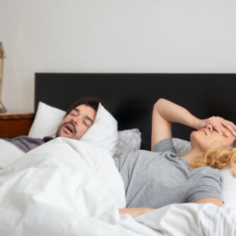 man sleeping beside a woman